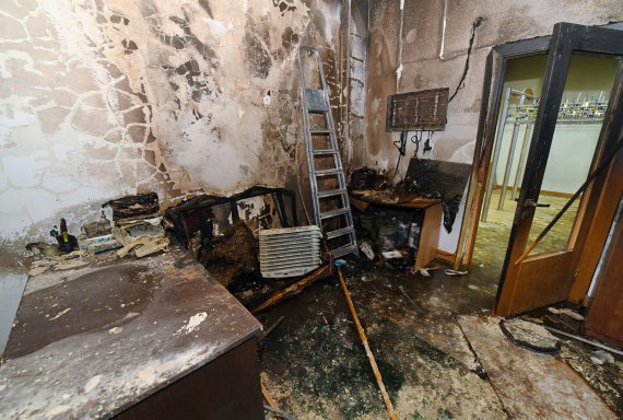 Поврежденное помещение в здании мэрии Алматы