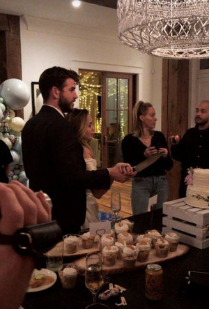   Miley Cyrus and Liam Hemsworth played a modest wedding 